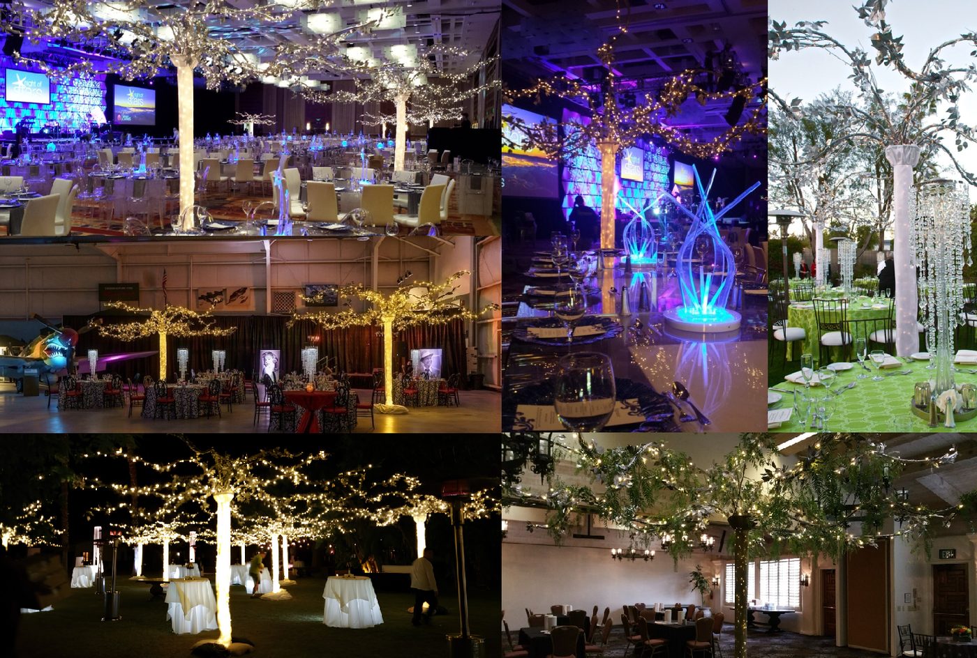 Illuminated twinkle trees in silver and greenery